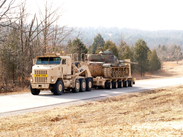 233rd Trans. Co. transports vehicles to improve ranges, gain experience