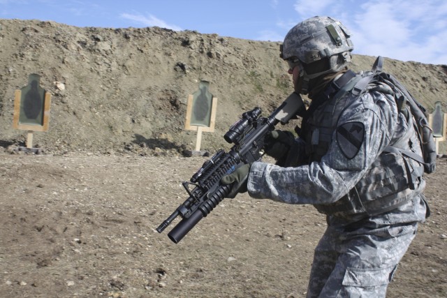 Sgt. Carter Martinelli, Co A, 2nd Battalion, 7th Cavalry Regiment, 4th Brigade Combat Team, 1st Cavalry Division, 'Long Knife,' prepares to engage a paper target at the unit's newly created Long Knife Range Complex Dec. 3. The range was...