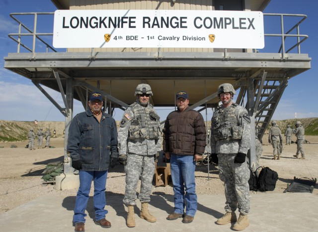 From Left to Right: Reynaldo Navarro, Col. Brian Winski, Eric Harmon and Capt. Matthew Makaryk pose for a picture in front of the 4th Brigade Combat Team, 1st Cavalry Division, 'Long Knife' new firing range complex on Fort Hood on Jan. 7. The...