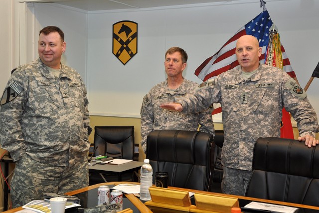 CONTINGENCY OPERATING LOCATION Q-WEST, Iraq - Lt. Gen. Kenneth Hunzeker, the United States Forces - Iraq deputy commanding general (right), speaks to members of the 15th Sustainment Brigade staff, while Brig. Gen. Paul Wentz, the 13th Sustainment Com...