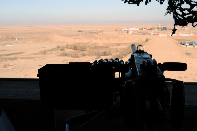 CONTINGENCY OPERATING LOCATION Q-WEST, Iraq - A .50 cal. machine gun overlooking an entry control point at Contingency Operating Location Q-West, Jan. 10. The ECP is manned by members of A Company, 2nd Battalion, 198th Combined Arms, 155th Brigade Co...