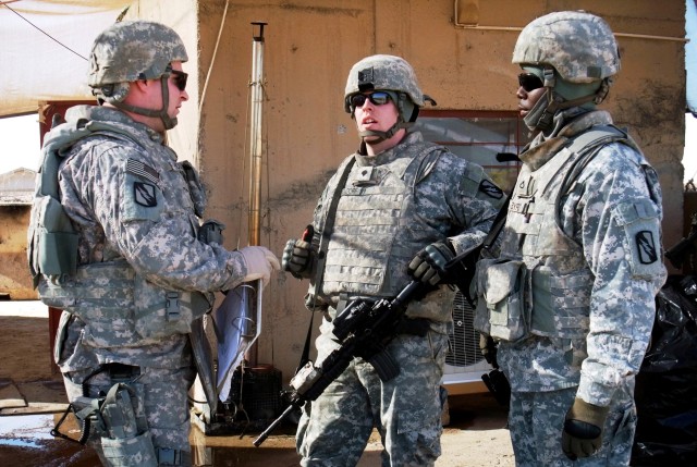 CONTINGENCY OPERATING LOCATION Q-WEST, Iraq - Staff Sgt. Nicholas Hughes (left), sergeant of the guard and native of Batesville, Miss., briefs Spc. Ryan E. Ohlendorf (middle), a native of Horn Lake, Miss., and Pfc. Quintavis B. Byrd, a native of Tutw...