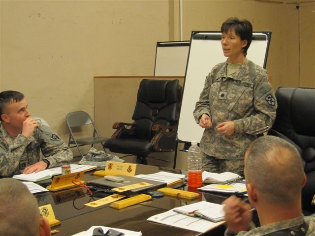 Lt. Col. Paula Lodi, the commander of the Special Troops Battalion, 15th Sustainment Brigade, 13th Sustainment Command (Expeditionary), briefs company and detachment commanders on 15th Sust. Bde. standards during the battalion's commander's conferenc...