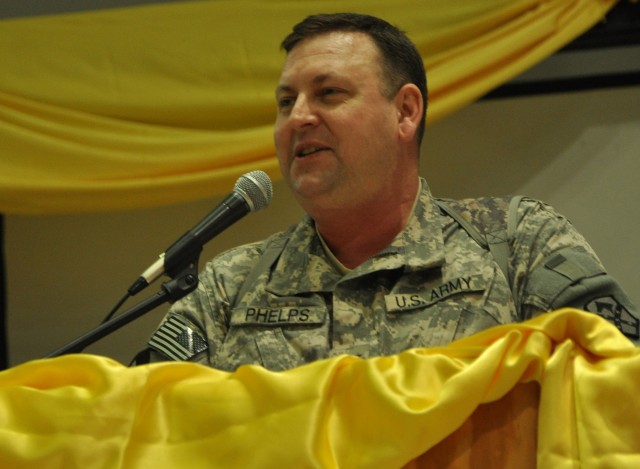 Col. Larry Phelps, 15th Sustainment Brigade commander and Greenville, Ala., native speaks at a Martin Luther King Jr. Day observance at the Morale Welfare and Recreation tent here Jan. 18, hosted by the 15th Special Troops Battalion, 15th...