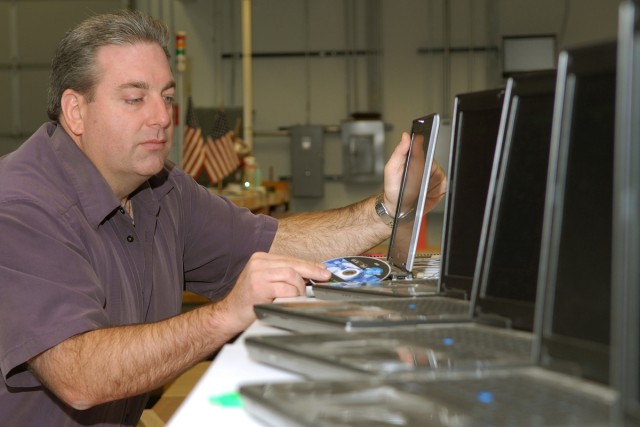Global support: Technicians refresh tri-service medical computers