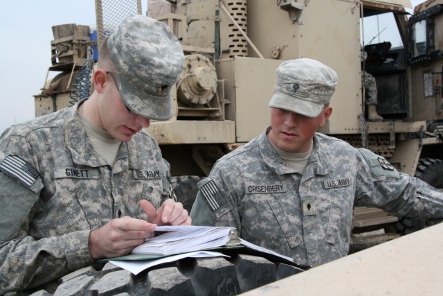 Spc. Brian Ginett, an Antigo, Wis., native, and Spc. Josh Crisenbery, a Cridersville, Ohio, native, both motor transport operators with the 1483rd Transportation Company, 541st Combat Sustainment Support Battalion, 15th Sustainment Brigade, 13th...