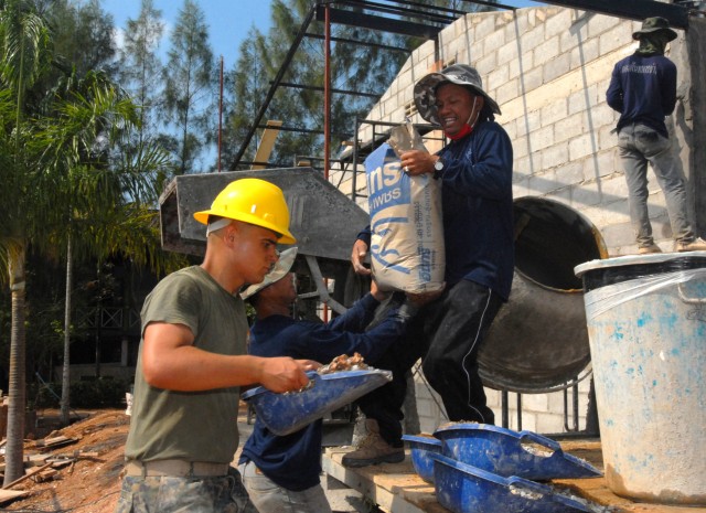 U.S. and Thai engineers work on school building
