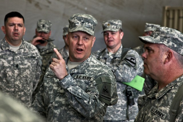 CAMP TAJI, Iraq - Brig. Gen. Kevin Mangum (center), from Newport News, Va., the deputy commanding general for 1st Armored Division, U.S. Division - Center, talks with Soldiers from 3rd Battalion, 227th Aviation Regiment, 1st Air Cavalry Brigade,...