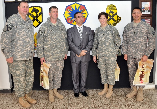 [From left to right] Col. Larry Phelps, commander of the 15th Sustainment Brigade, 13th Sustainment Command (Expeditionary), and Greenville, Ala., native; Brig. Gen. Paul Wentz, commander of the 13th ESC out of Fort Hood, Texas; Yayah Sami Jamil,...