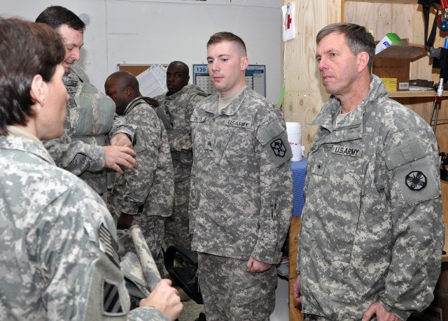 Lt. Col. Paula Lodi [foreground], 15th Special Troops Battalion, 15th Sustainment Brigade, 13th Sustainment Command (Expeditionary) and Franklin, Mass., native, informs Brig. Gen. Paul Wentz, commander of the 13th ESC out of Fort Hood, Texas,...