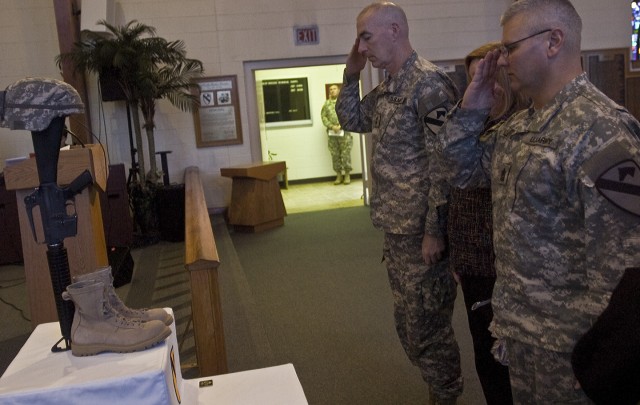 1st Cavalry Division Commanding General, Maj. Gen. Daniel Bolger, and division Command Sergeant Major Rory Malloy, salute a memorial for Sgt. David Croft and Pvt. Jhanner Tello Jan. 28 during a memorial Service at Fort Hood. Tello passed from non...