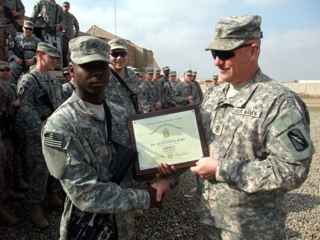 CONTINGENCY OPERATING LOCATION Q-WEST, Iraq - Pfc. Quintavis B. Byrd (left) - an entry control point sentry and native of Tutwiler, Miss., serving with A Company, 2nd Battalion, 198th Combined Arms, 155th Brigade Combat Team, out of Hernando, Miss. -...