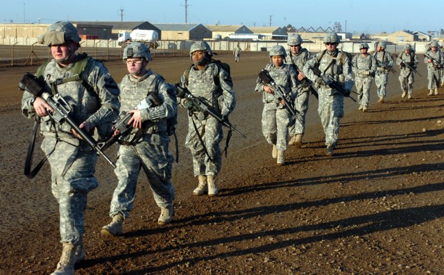 CAMP TAJI, Iraq-Medics from 1st Air Cavalry Brigade, 1st Cavalry Division, U.S. Division-Center, engage in a short road march on a brisk morning Feb. 5. The medics marched to the Forward Arming and Refueling Point, where they conducted a mass...