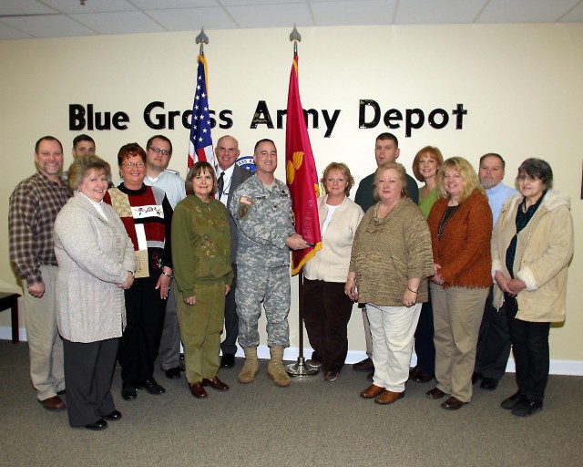 BGAD Employees Pose with Their Award