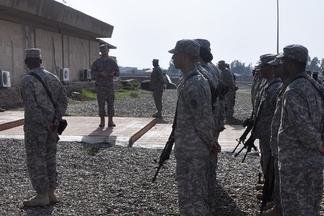 Lt. Col. William B. Smith Jr., the outgoing Contingency Operating Location Q-West mayor, speaks to the Soldiers of the Special Troops Battalion, 15th Sustainment Brigade, 13th Sustainment Command (Expeditionary), during a ceremony here Feb. 1. The ST...