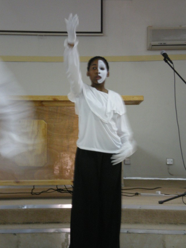 CAMP LIBERTY, Iraq-Pfc. Jaimie Naylor performs a dance routine with the dance ministry team at sunday gospel service, located at Warrior Chapel here. The team is comprised of several Soldiers located throughout the Victory Base Complex that are...
