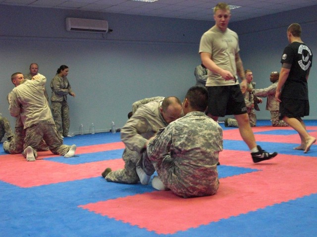 Spc. Jeffery Putnam, a Raleigh, N.C., native and ammunition specialist for 63rd Ordnance Company, 80th Ordnance Battalion, 15th Sustainment Brigade, 13th Sustainment Command (Expeditionary) and Combatives Level 3 instructor, teaches a Level 1...