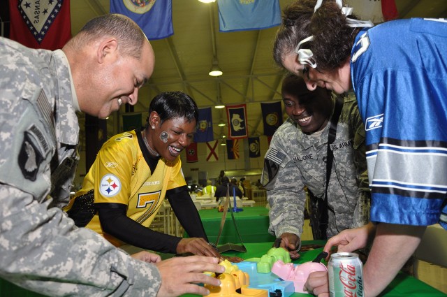 [From left to right] Maj. Frank Cruzcaraballo, a Carolina, Puerto Rico, native and 15th Sust. Bde. supply section officer in charge; Staff Sgt. Kezia Will, the brigade's supply maintenance non-commissioned officer in charge and Montgomery, Ala.,...