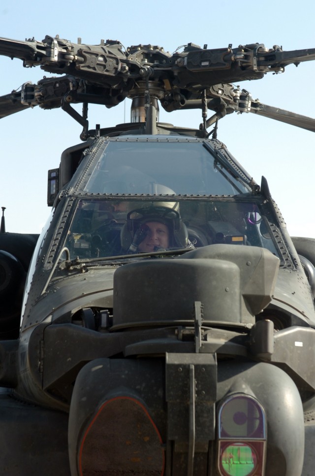 CAMP TAJI, Iraq - Looking out of the front window of an AH-64D Apache attack helicopter, Spc. Michael Moye, an Apache crew chief for Company A, 4th Battalion, 227th Aviation Regiment, 1st Air Cavalry Brigade, 1st Cavalry Division, U.S. Division-Cente...