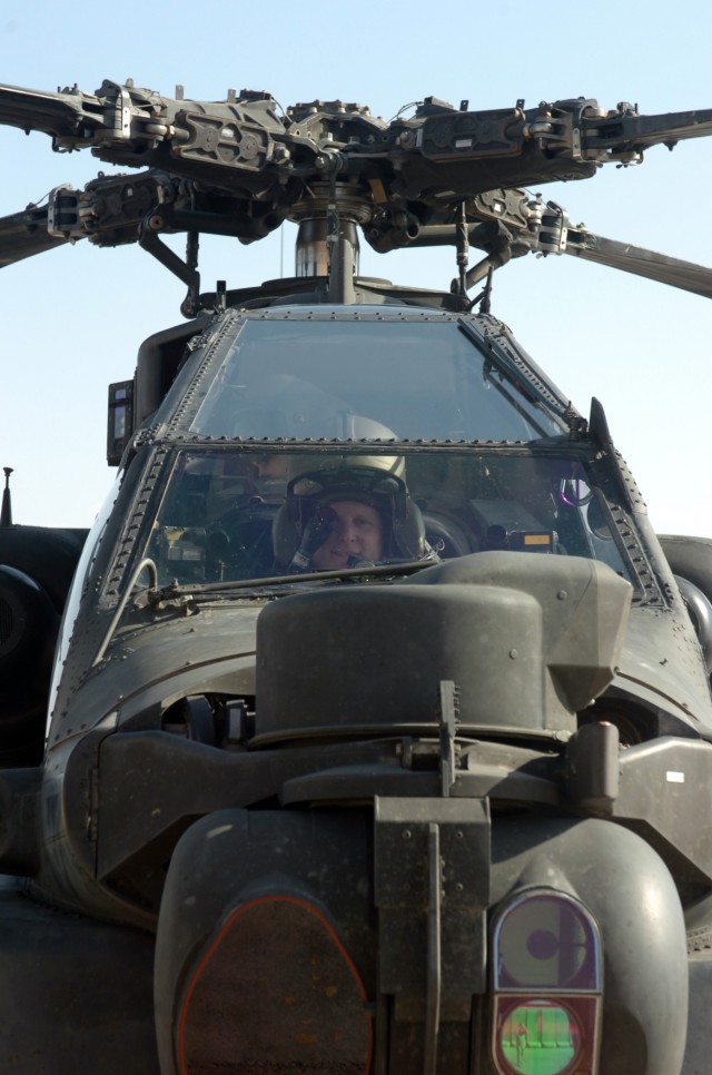CAMP TAJI, Iraq - Looking out of the front window of an AH-64D Apache attack helicopter, Spc. Michael Moye, an Apache crew chief for Company A, 4th Battalion, 227th Aviation Regiment, 1st Air Cavalry Brigade, 1st Cavalry Division, U.S....