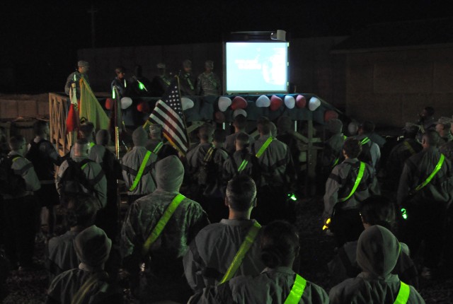 Soldiers watch the Army's "I. A.M. Strong" video before taking part in a theater-wide sexual assault awareness walk Feb. 12 at Contingency Operating Location Q-West, Iraq. (U.S. Army photo by Staff Sgt. Rob Strain, 15th Sustainment Brigade Public Aff...