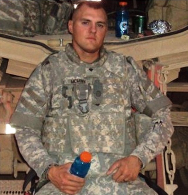 CONTINGENCY OPERATING LOCATION Q-WEST, Iraq - Spc. James B. McMinn, a Lake Village, Ark., native and a gunner serving with B Company, 2nd Battalion, 198th Combined Arms, 155th Brigade Combat Team, out of Greenwood, Miss., rests on the rear door...