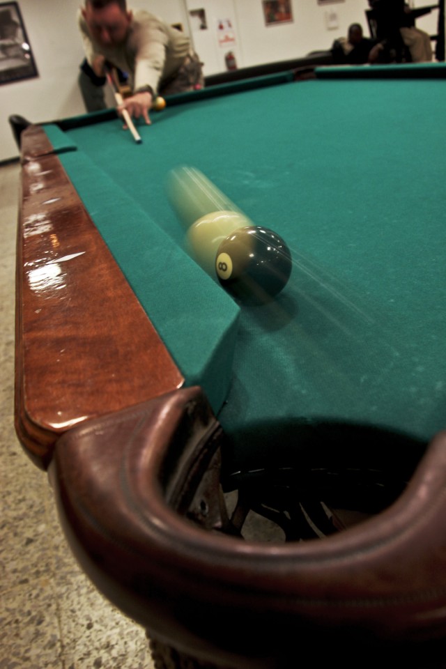 CAMP TAJI, Iraq - During a nine ball pool tournament hosted by 1st Air Cavalry Brigade, 1st Cavalry Division, U.S. Division-Center, Staff Sgt. Sean Harrington, a cavalry scout in 2nd Squadron, 1st Cavalry Regiment, 4th Stryker Brigade Combat Team, 2n...
