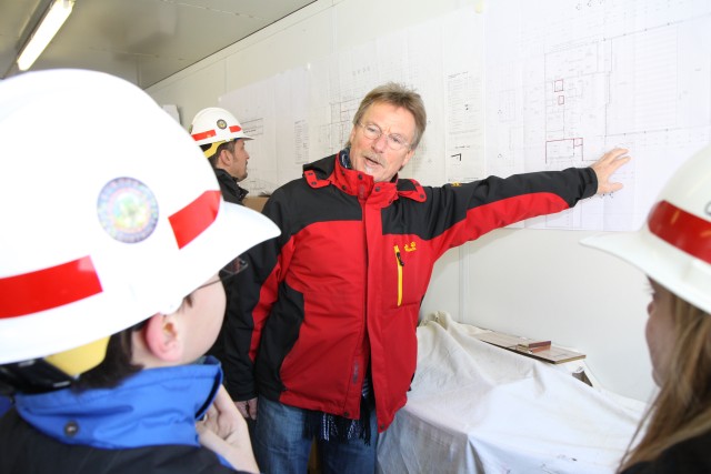 Karl Klein, a resident engineer with the U.S. Army Corps of Engineers Europe District, explains how engineering design uses mathematics to a group of Wiesbaden Middle School students as they toured the Wiesbaden Entertainment Center construction...