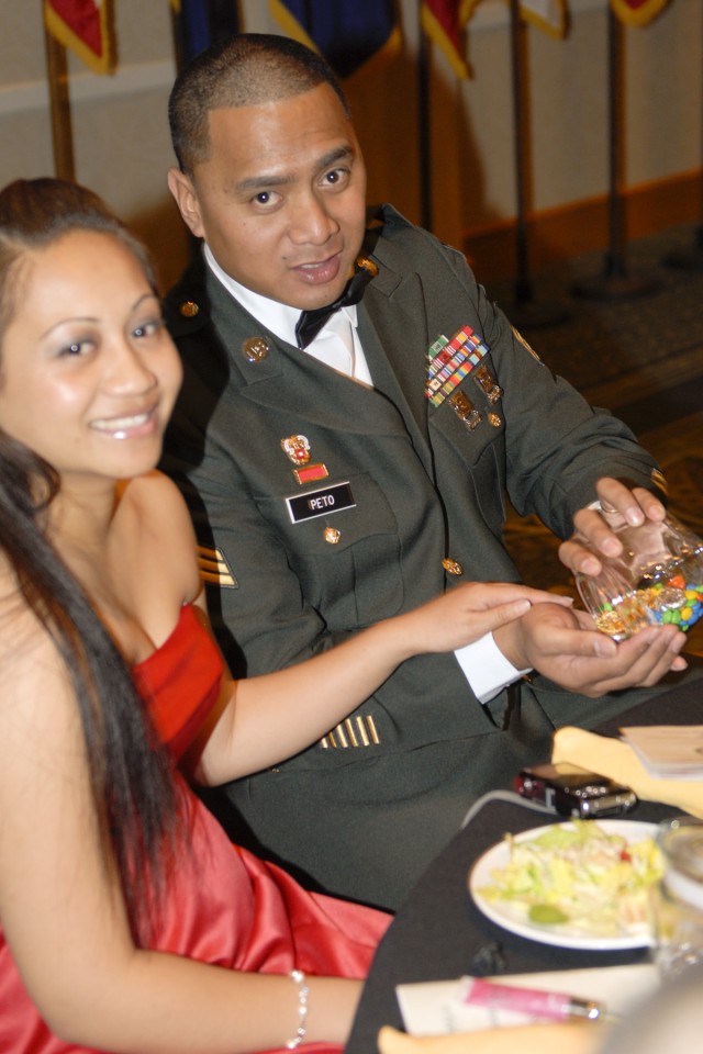 Sgt. Freddie Peto, who works in the communications section of the 3rd Brigade Special Troops Battalion, 3rd Heavy Brigade Combat Team,1st Cavalry Division enjoys an evening meal with his wife Marie during a military ball held Feb. 5 at the Killeen Ci...