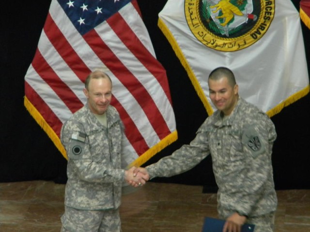 Spc. Francisco Robles, a mechanic with the 3666th Support Maintenance Company, 541st Combat Sustainment Support Battalion, 15th Sustainment Brigade, 13th Sustainment Command (Expeditionary), shakes the hand of Lt. Gen. Charles Jacoby Jr., the command...