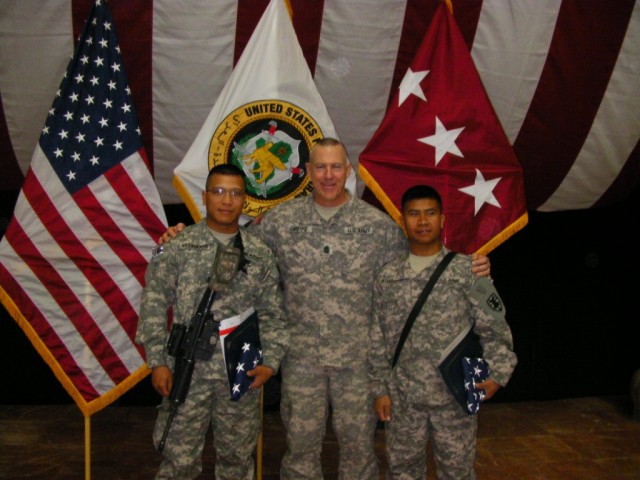 Cpl. Pramote, a mechanic with the 724th Transportation Company, 264th Combat Sustainment Support Battalion, 15th Sustainment Brigade, 13th Sustainment Command (Expeditionary), and Bangkok, native, and Spc. Erwin Atmosfera, a mechanic with the...