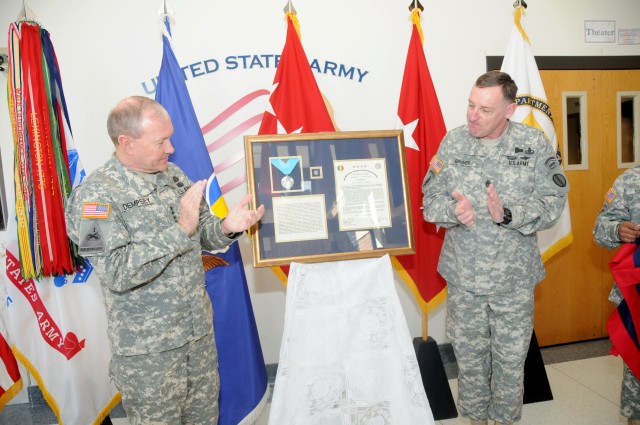 Gen. Martin E. Dempsey presents award