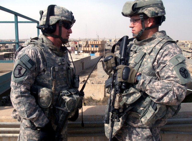CONTINGENCY OPERATING LOCATION Q-WEST, Iraq - Capt. Drew Clark (left) - a resident of Madison, Miss., and commander of A Company, 2nd Battalion, 198th Combined Arms, 155th Brigade Combat Team, out of Hernando, Miss., the Q-West force protection...