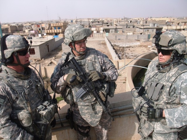 CONTINGENCY OPERATING LOCATION Q-WEST, Iraq - Capt. Drew Clark (left) - a resident of Madison, Miss., and commander of A Company, 2nd Battalion, 198th Combined Arms, 155th Brigade Combat Team, out of Hernando, Miss., the Q-West force protection...