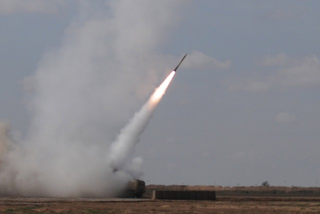 CONTINGENCY OPERATING LOCATION Q-WEST, Iraq - A rocket from the C Battery, 1st Battalion, 14th Field Artillery, Task Force Leader, departs its high mobility artillery rocket system launcher here on its way to destroy an enemy mortar position Mar....