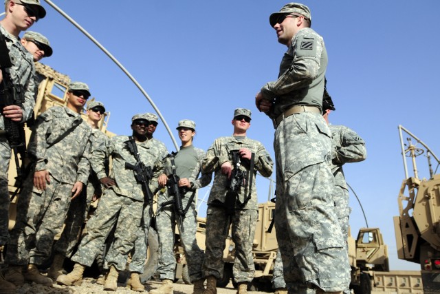 BAGHDAD - First Lieutenant Michael McCrory, 3rd Brigade Support Battalion A Co., briefs his quick response force team outside their MRAPs on Contingency Operating Station Falcon March 7. As part of a quick response force team, they were prepared...