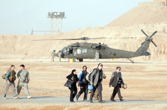 CAMP RAMADI, Iraq - Monitoring teams with United Nations Assistance Mission for Iraq and reporters from the Christian Science Monitor and New York Times arrive at Camp Ramadi, Iraq, to cover Iraqi national elections March 7. Paratroopers with 1st...