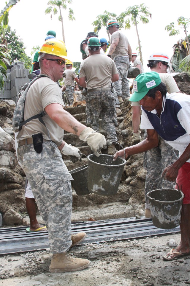 The 56th Engineer Company, U.S. Army, Alaska and members of the Armed Forces of the Philippines help build New Medical Center in support of Balikatan 2010