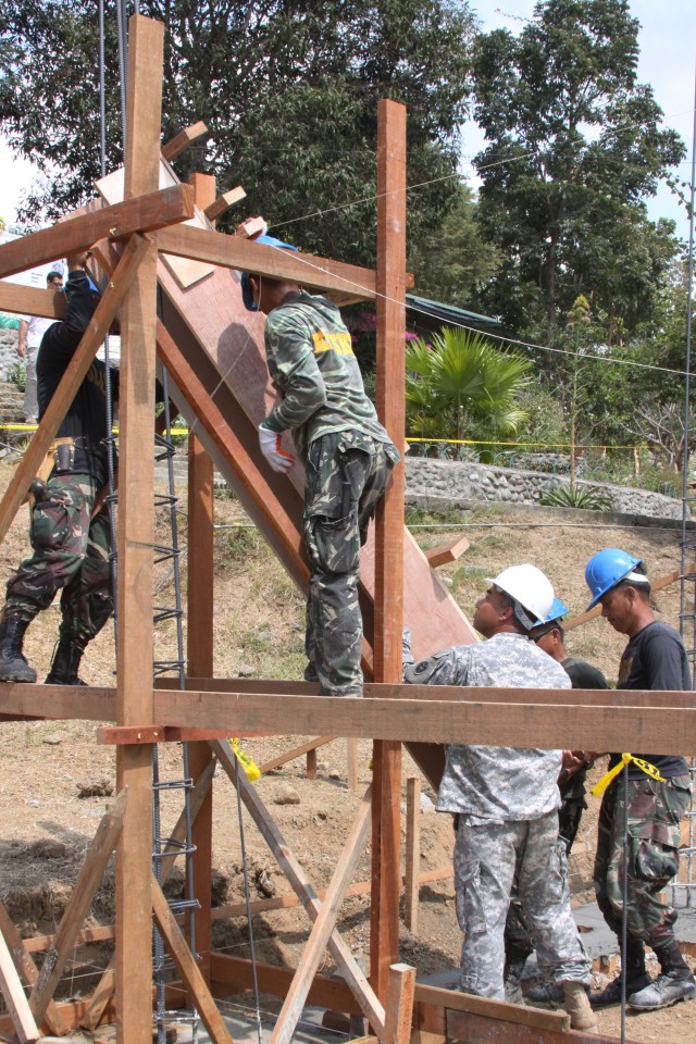 The 56th Engineer Company, U.S. Army, Alaska and members of the Armed Forces of the Philippines help build New Medical Center in support of Balikatan 2010