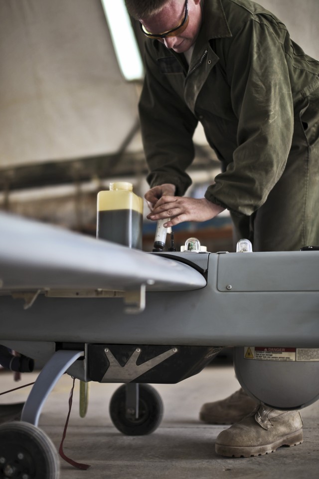 CAMP TAJI, Iraq - Ensuring the Shadow unmanned aerial vehicle is ready for the next flight, Spc. Ben Hughes, from Fort Drum, N.Y., a Shadow maintainer in 2nd Brigade Special Troops Battalion, 2nd Brigade Combat Team, 10th Mountain Division, U.S....