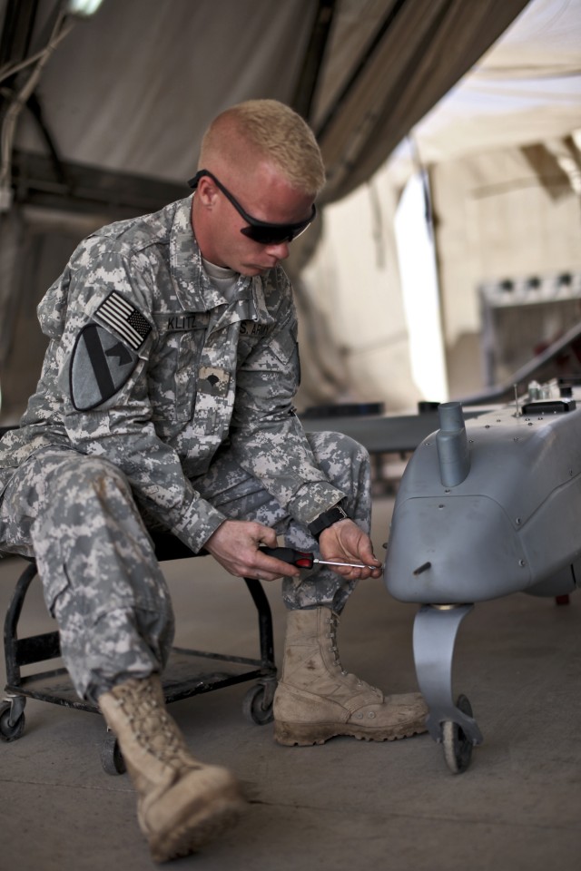 CAMP TAJI, Iraq - After completing a post-flight inspection of a Shadow unmanned aerial vehicle, Richard Klitz, from Fort Lewis, Wash., a UAV maintainer with 2nd Battalion, 1st Cavalry Regiment, 4th Brigade Combat Team, 2nd Infantry Division, USD-C, ...