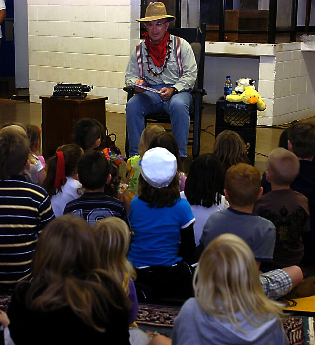 Soldiers read Suess stories to students