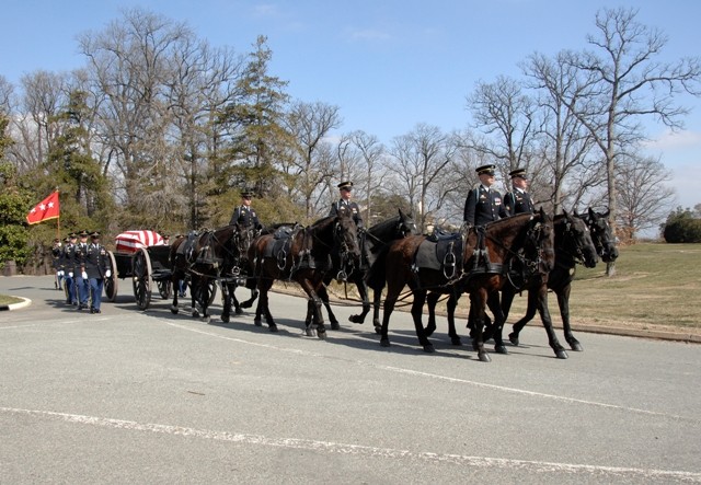 Caissons roll along, carrying the late Lt. Gen. (ret) Larry J. Dodgen, his casket draped with the American flag.  Soldiers from the 3rd Infantry Regiment, "The Old Guard," perform this solemn duty as they carry the three-star officer flag.  Dodgen wa...