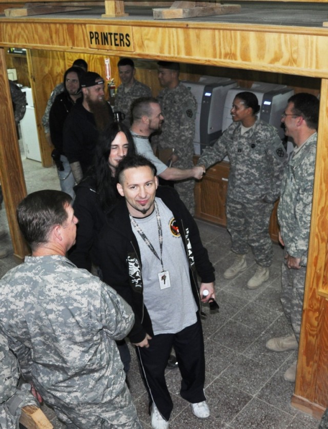 Members of heavy metal band Five Finger Death Punch met with Soldiers from the 15th Sustainment Brigade during the band's visit to Contingency Operating Location Q-West, Iraq, March 5. (U.S. Army photo by Staff Sgt. Rob Strain, 15th Sustainment...