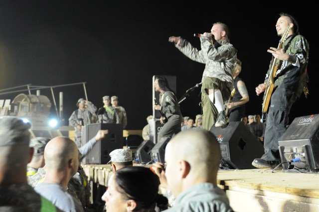 Five Finger Death Punch, a heavy metal band from Los Angeles, performs for service members at Contingency Operating Location Q-West, Iraq, March 5. This tour is the band's first visit to Iraq. (U.S. Army photo by Staff Sgt. Rob Strain, 15th...