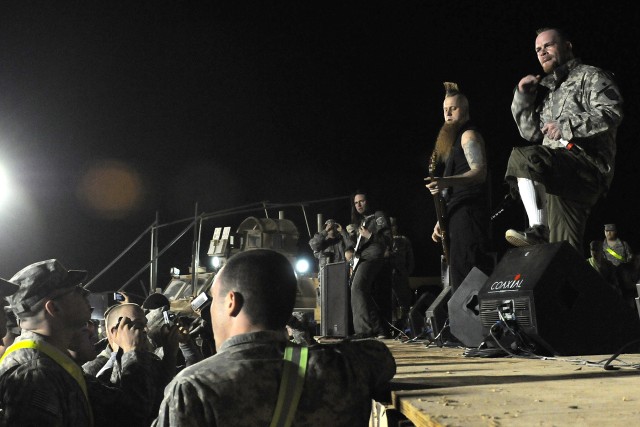 Five Finger Death Punch, a heavy metal band from Los Angeles, performs for service members at Contingency Operating Location Q-West, Iraq, March 5. This tour is the band's first visit to Iraq. (U.S. Army photo by Staff Sgt. Rob Strain, 15th...