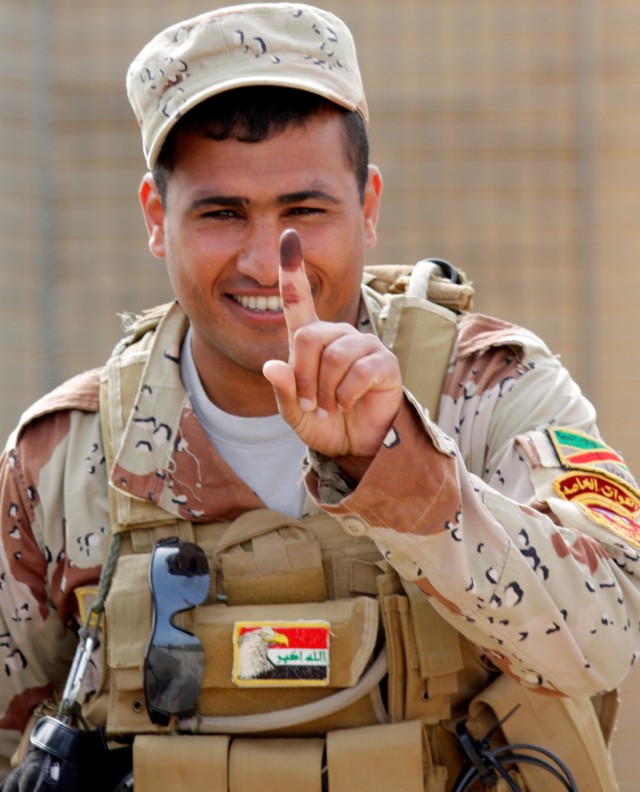 CONTINGENCY OPERATING LOCATION Q-WEST, Iraq -An Iraqi Army Soldier displays his voting finger proudly to Soldiers of C Company, 1st Squadron, 278th Armored Cavalry Regiment of the Tennessee Army National Guard headquartered in Henderson, Tenn.  The I...