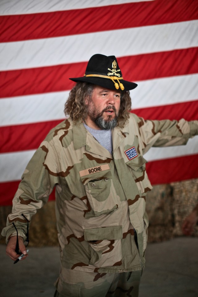 CAMP TAJI, Iraq - During a town hall meeting with Soldiers from 1st Air Cavalry Brigade, 1st Cavalry Division, U.S. Division-Center, March 15, Mark Boone Jr., an actor in the television show "Sons of Anarchy," borrows a first sergeant's Stetson to...