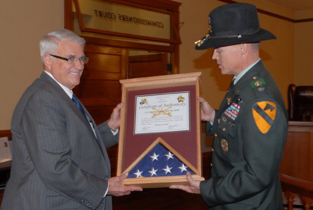 Congressman Dan Carter (left) accepts a flag from Lt. Col. Andy Shoffner, commander of 4th Squadron, 9th Cavalry Regiment, 2nd Brigade Combat Team, 1st Cavalry Division, during a ceremony in Williamson County. The flag was flown over the...