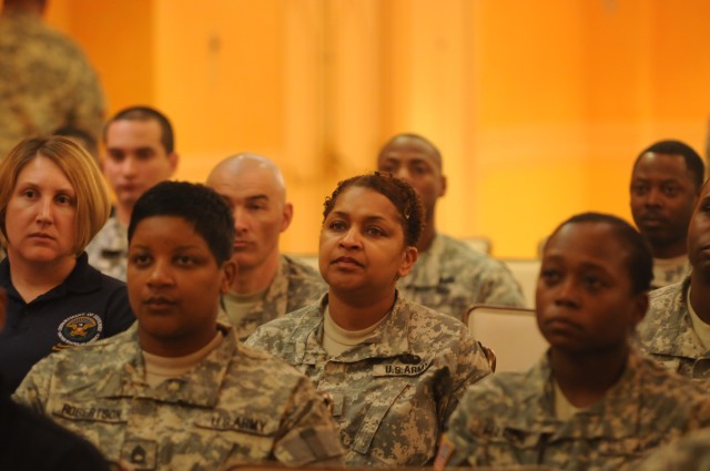 Members of The Military District of Washington Audie Murphy Club Chapter listen intently